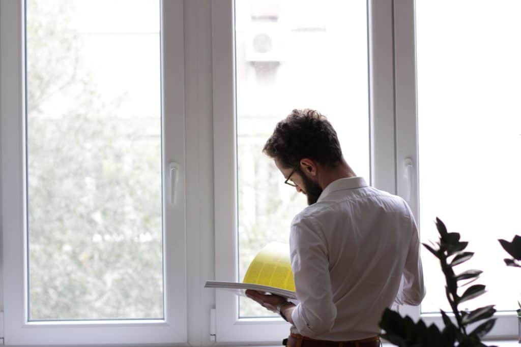 man reading with long beard and full hair