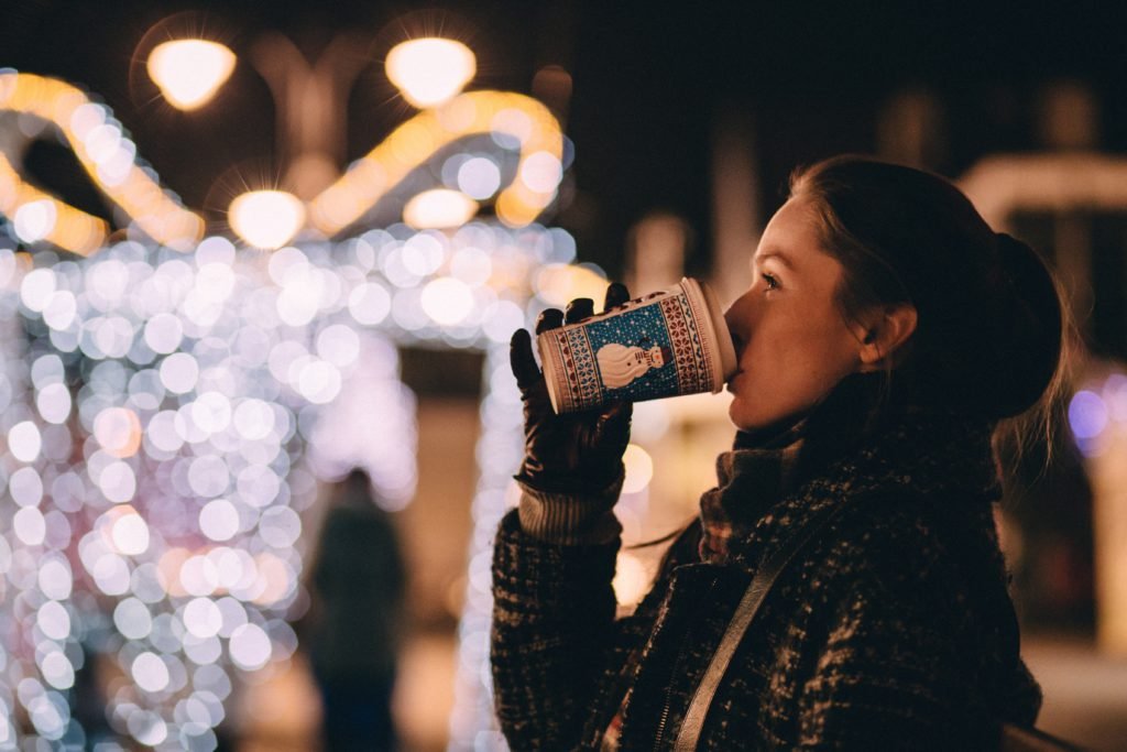 girl drinking coffee at christmas