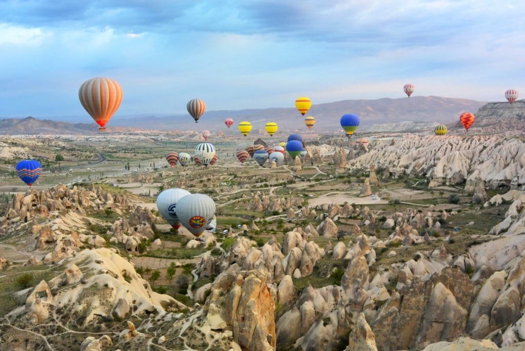 hot air balloons over turkish mountain