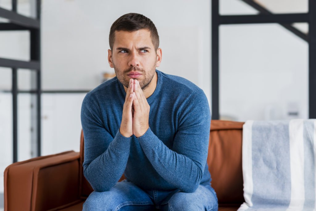 man thinking but looking confident after injerto capilar